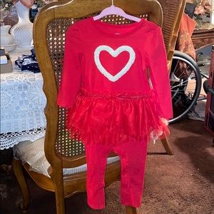 A one piece with tutu attached with a heart